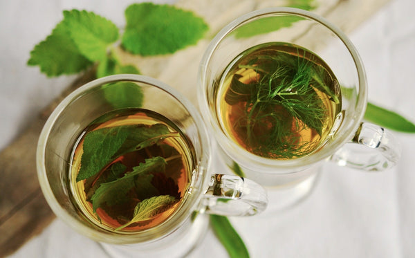 2 glasses with peppermint tea leaves in