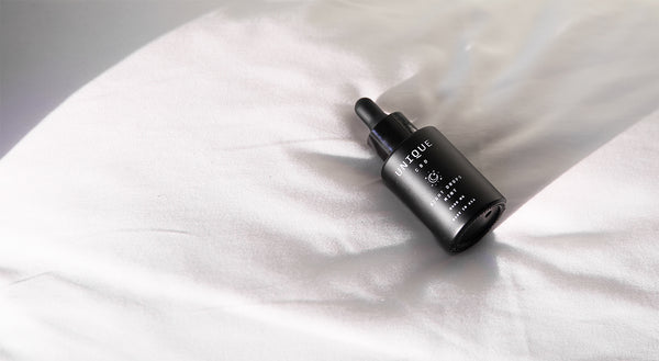 night drops cbd bottle on pillow