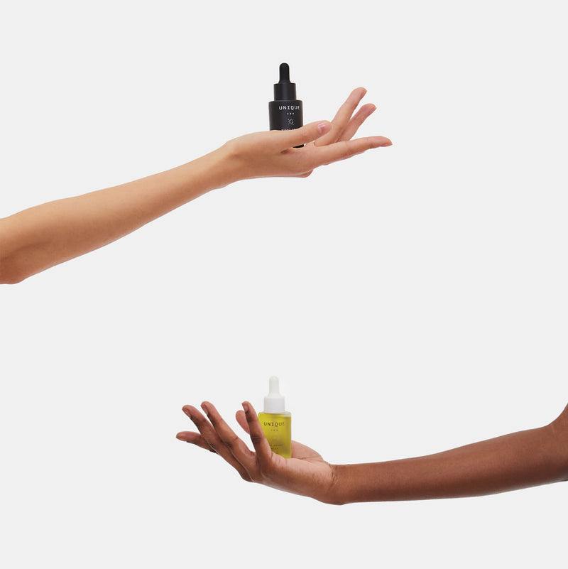 Unique cbd day and night drops cbd oil tinctures held by hands