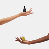 Hands holding Unique CBD Day and Night Drops